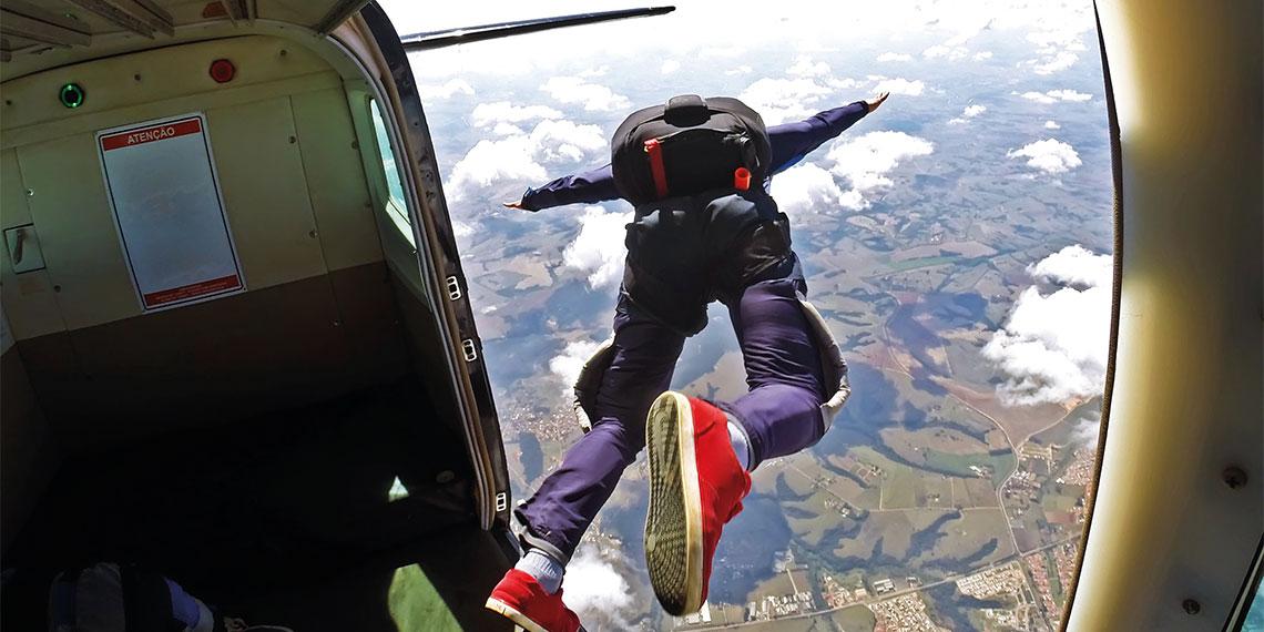 skydiver jumping out of plane