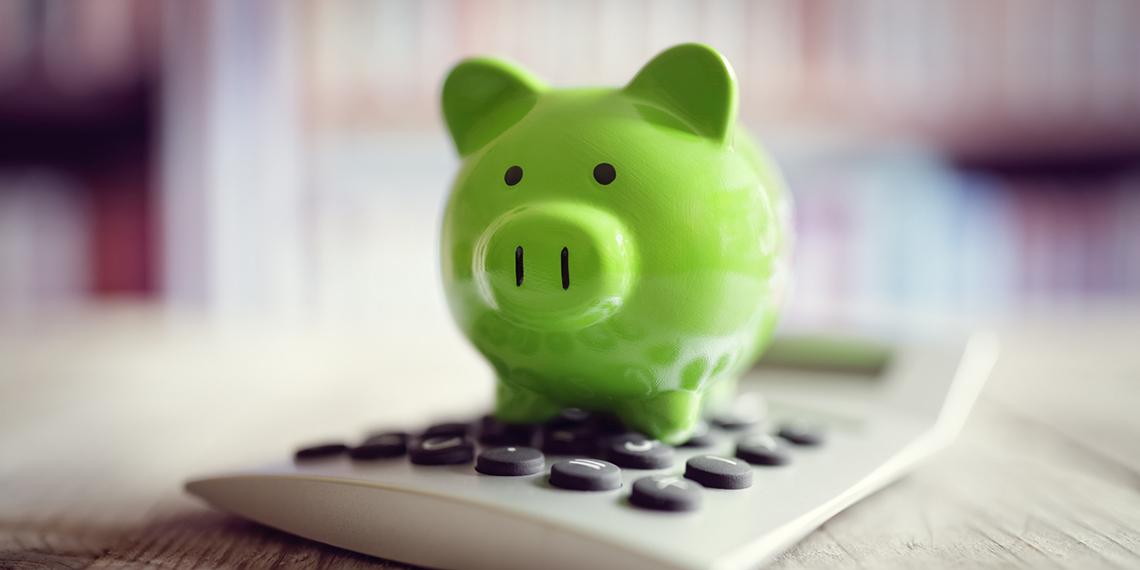 a piggy bank and calculator