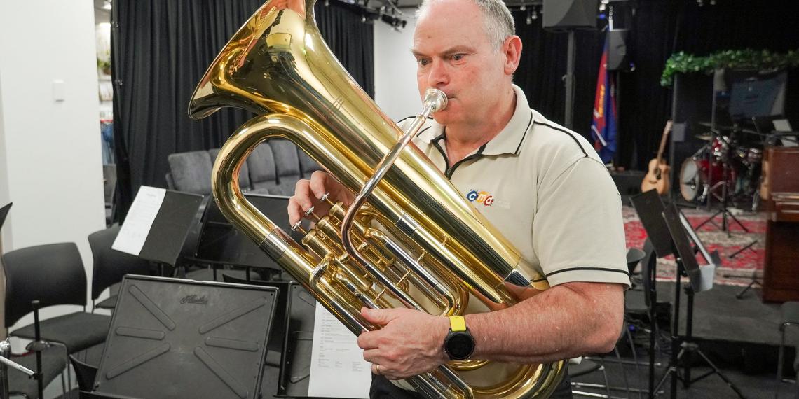 Jim Downey hunting for used brass instruments for Fiji's 50th celebrations