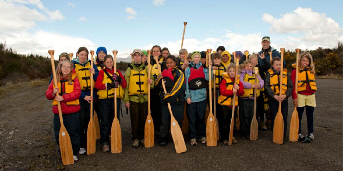 A group of children with paddles at Blue Mountain Adventure Centre