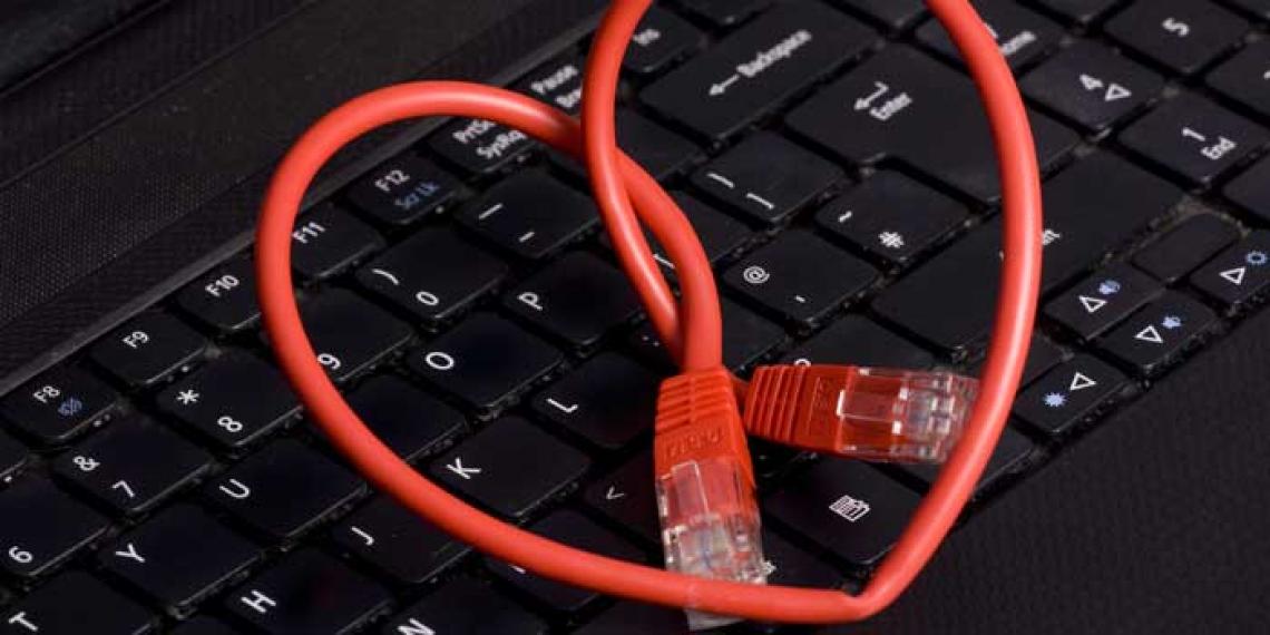 A heart shape lying on a computer keyboard