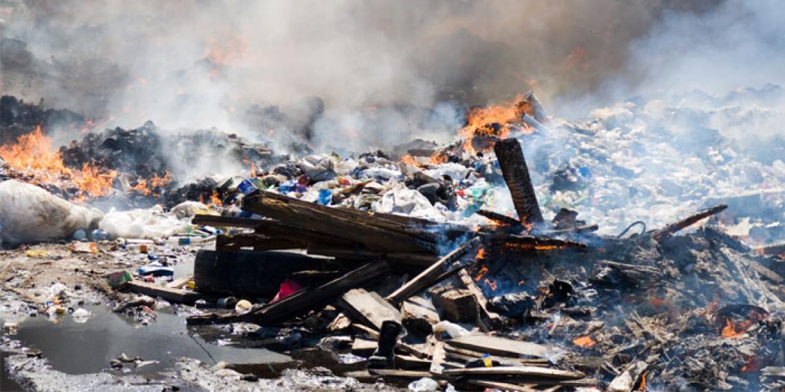 a large pit of rubbish on fire