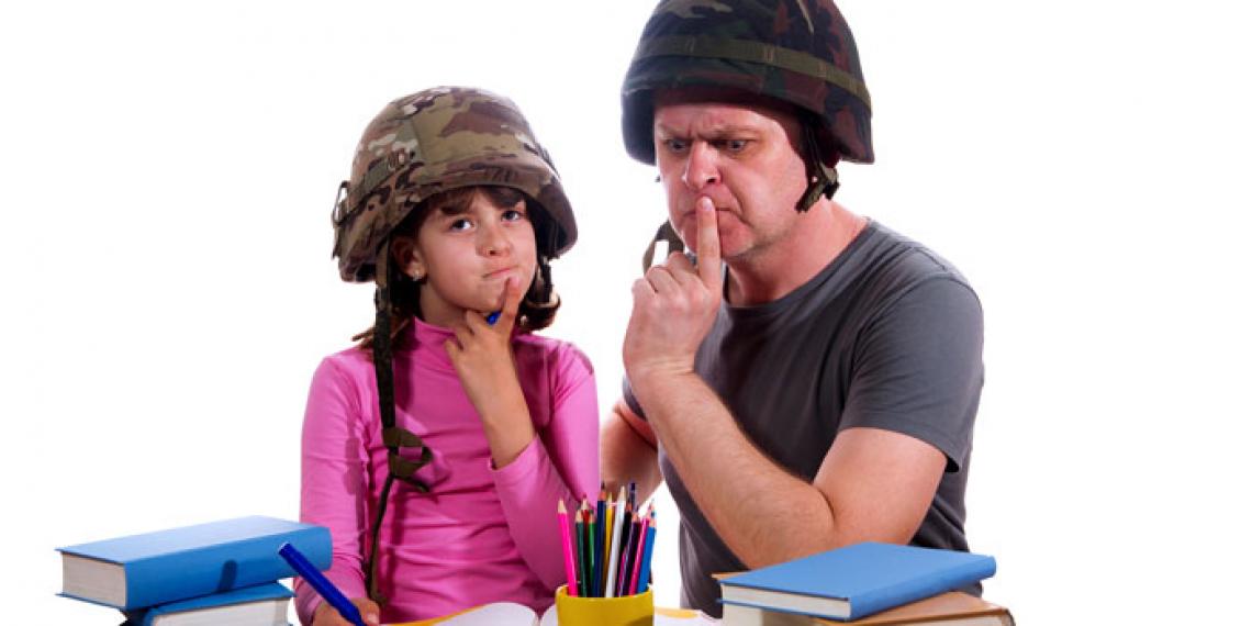 a dad helping his daughter with homework