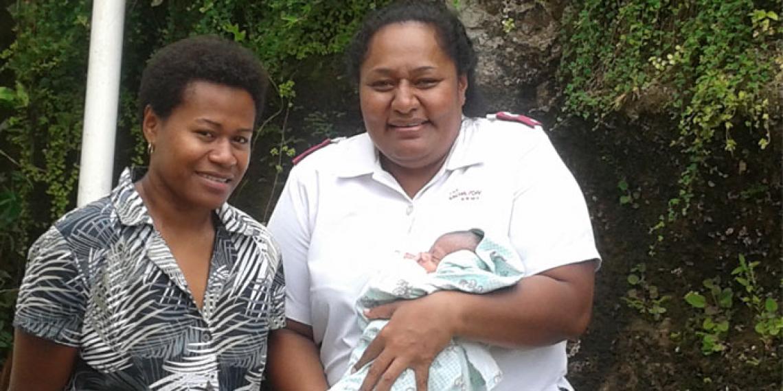 Suva Family Care Centre Manager Lieutenant Varea Rika and case worker Thias Bott with a new addition to the centre, a prematurely born baby. The baby’s mother entered the centre with her other children following ongoing relationship issues with her husband and financial difficulties.