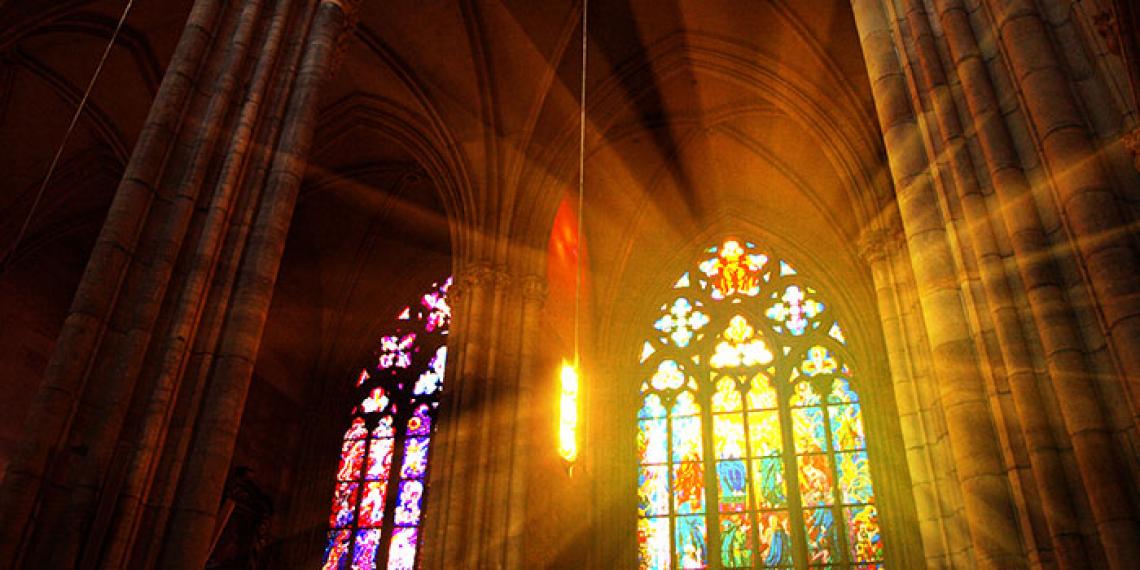 Stained glass window with sun shining through