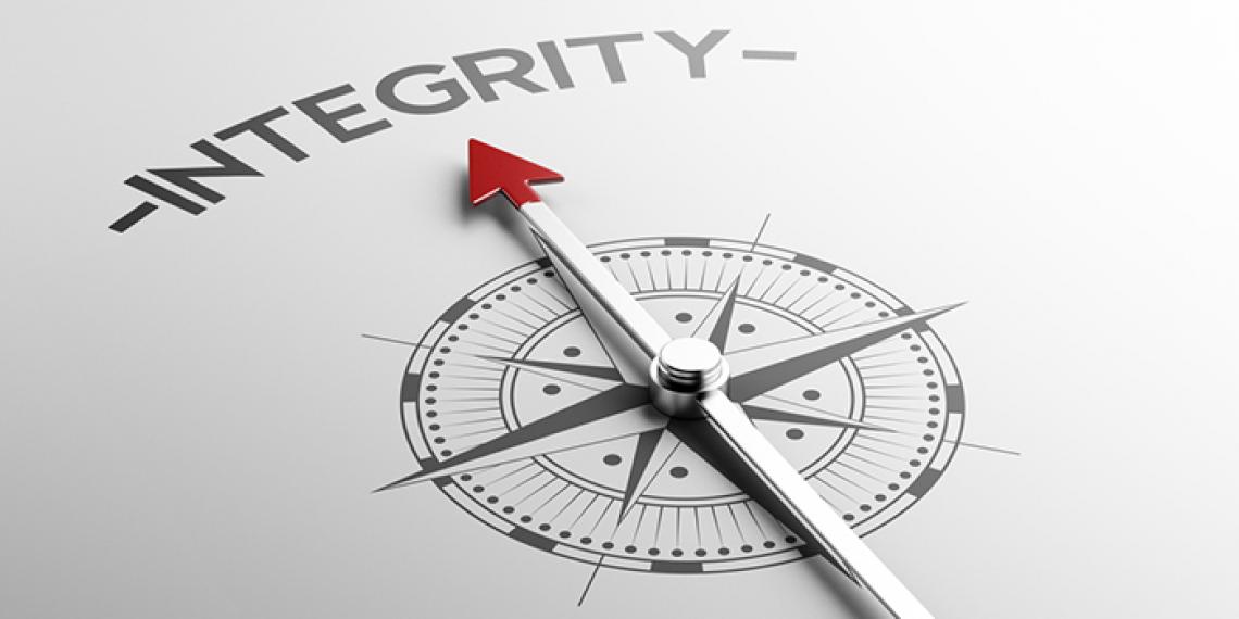a compass pointing to the word integrity