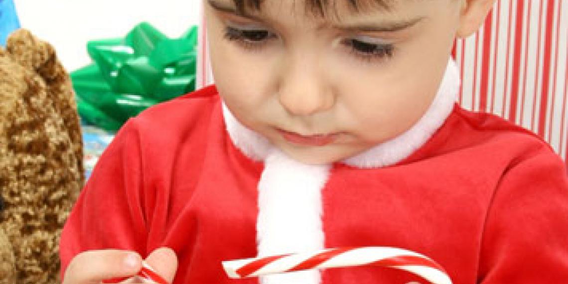 Child frowing at a broken candy cane